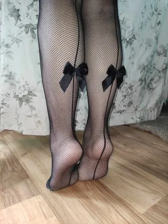 bare feet and fishnet feet heels         