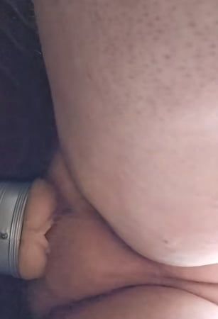 Fucking a sex toy while watching porn