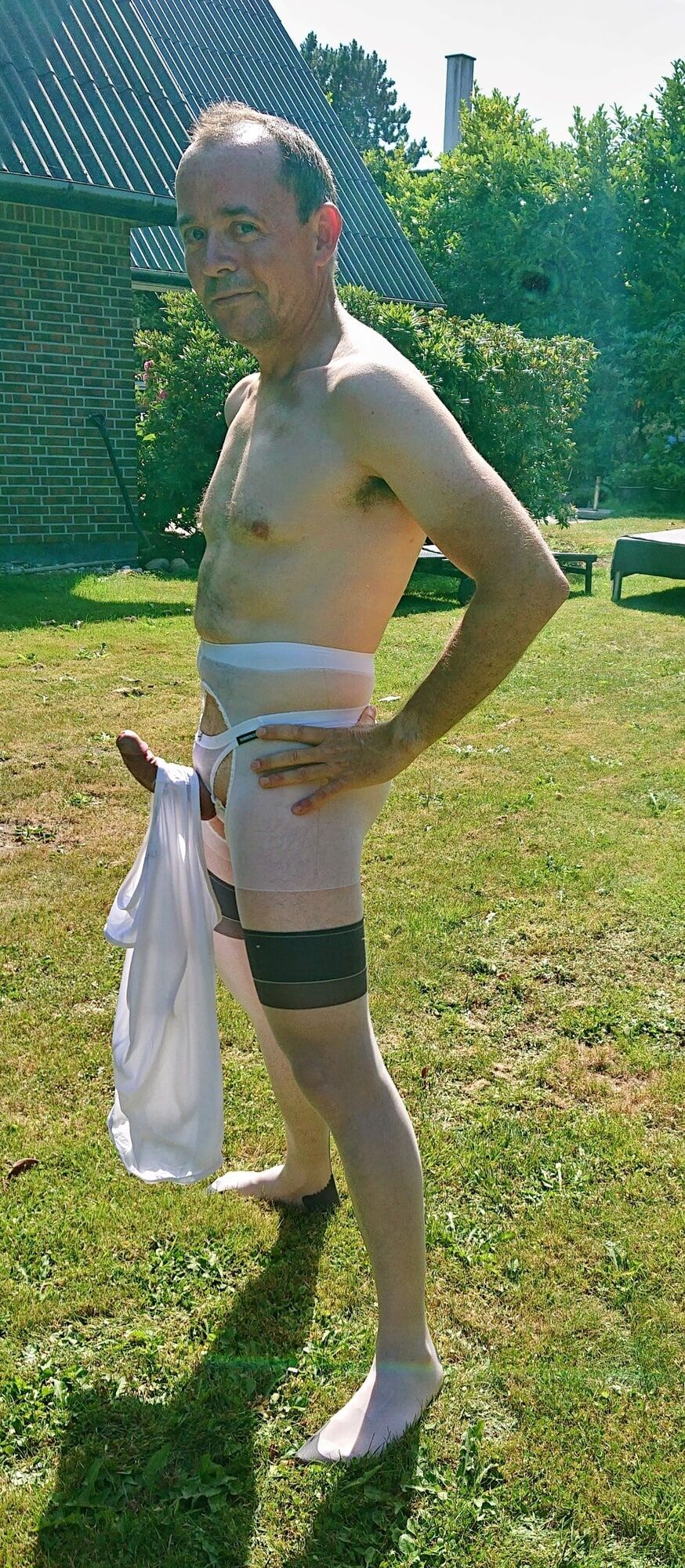 Posing in sexy nylon lingerie in a garden #29