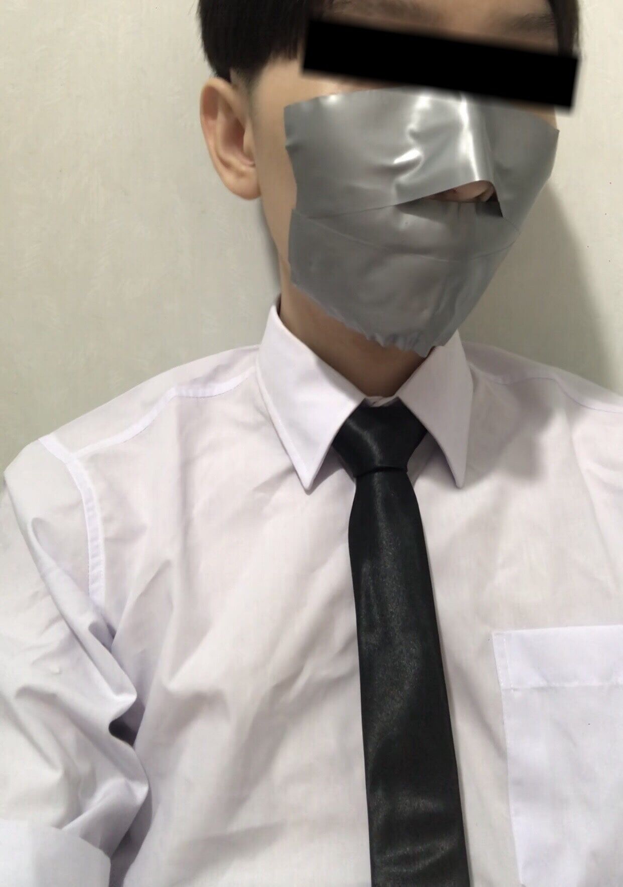 Wearing a white shirt and shiny black tie, gagged with duct  #17