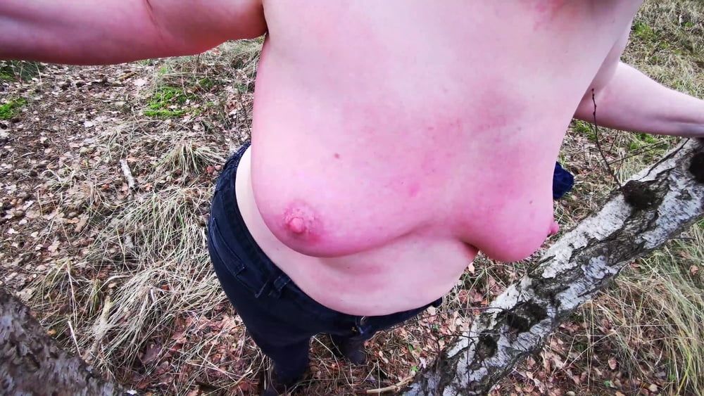 Titslapping in woods