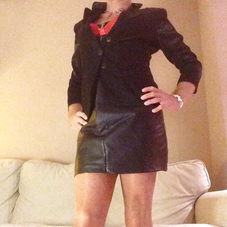 Kinky in leather skirt, stockings, satin lingerie
