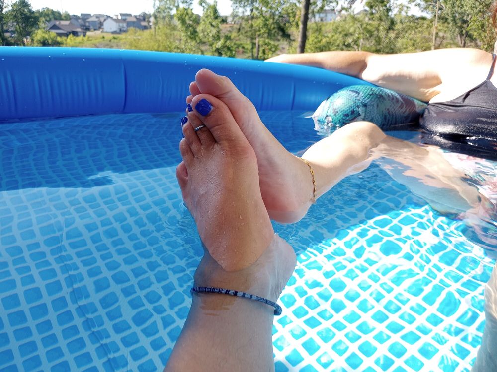 Showing off our pedicures in the pool #25