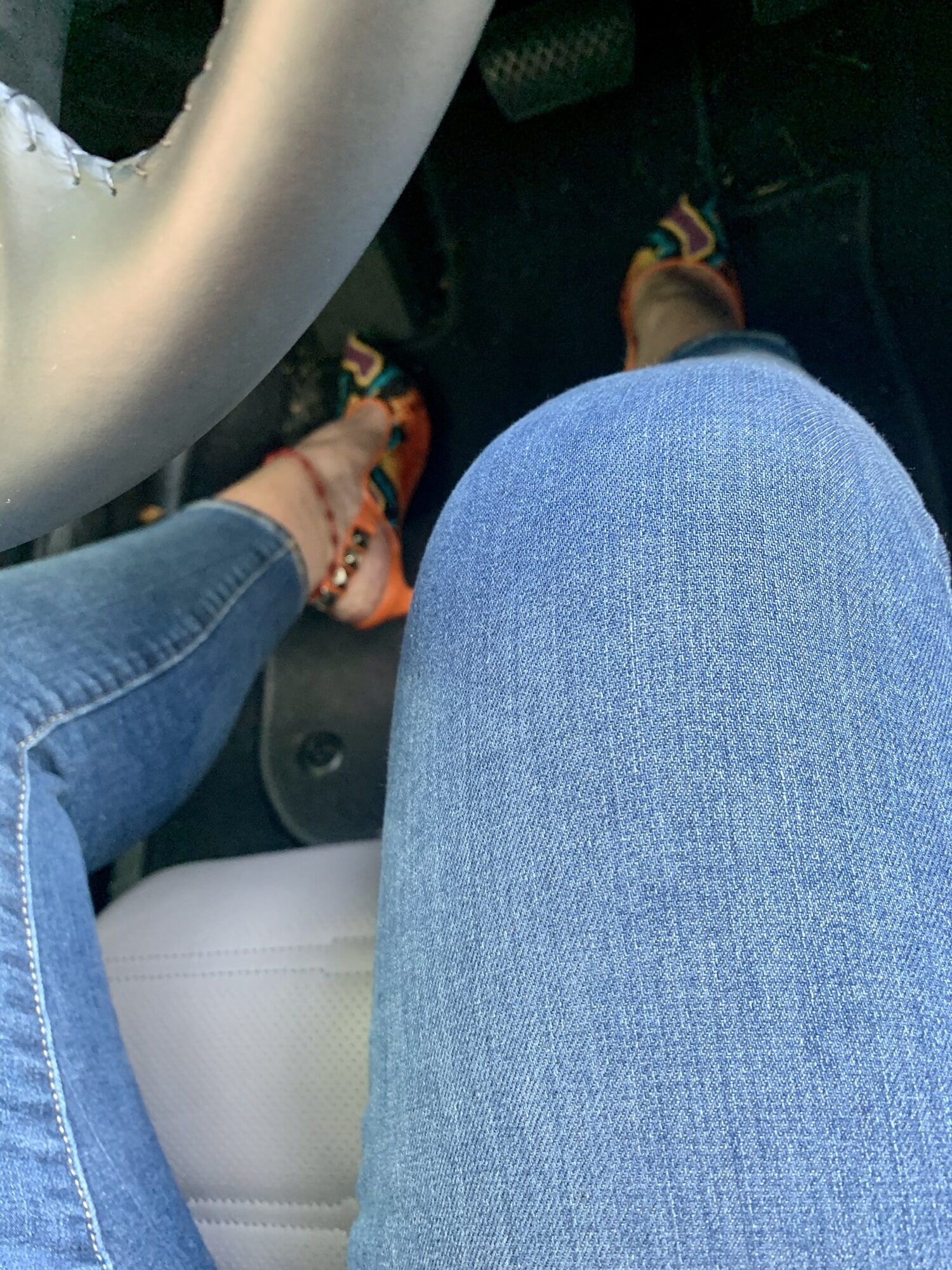 Hot sexy legs wife in high heels and jeans selfie in car