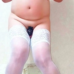 Sissy in white stockings and Chastity Belt