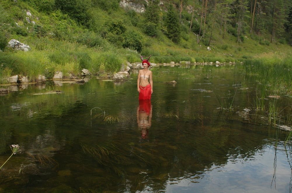 With Horns In Red Dress In Shallow River #16