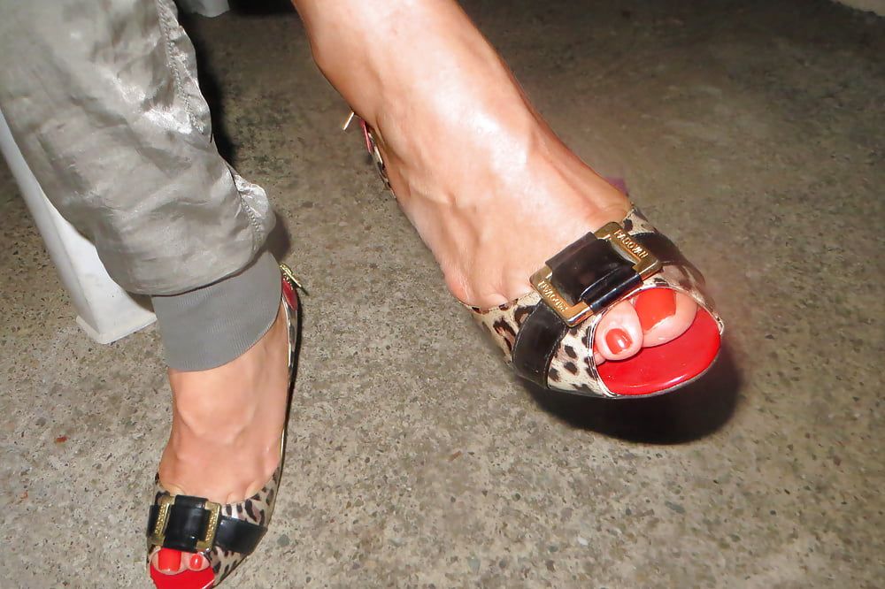 red toesnails in her tiger-pumps in a patio #16