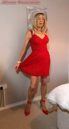    alessia travestita in flirty red dress         