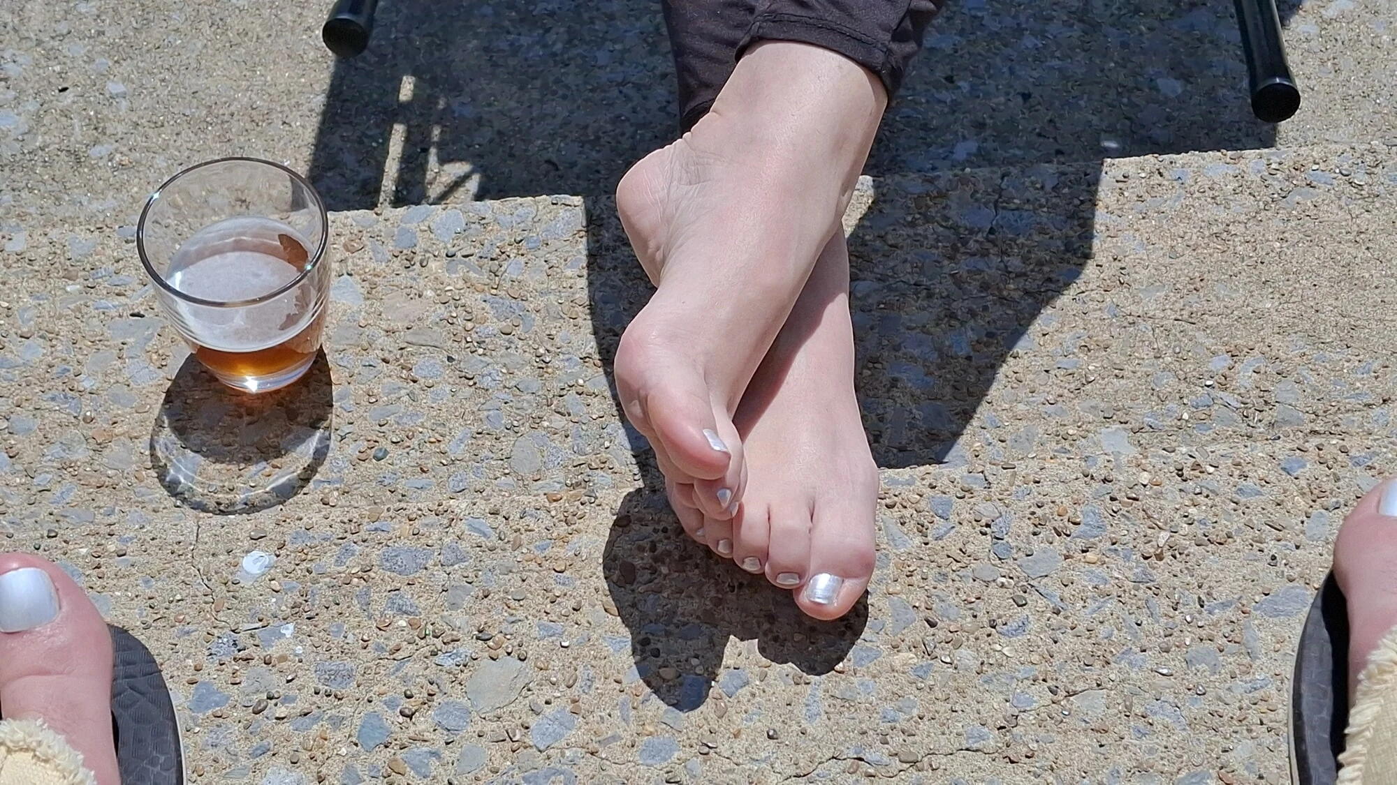 Relaxing outside showing our pedicured and painted toes