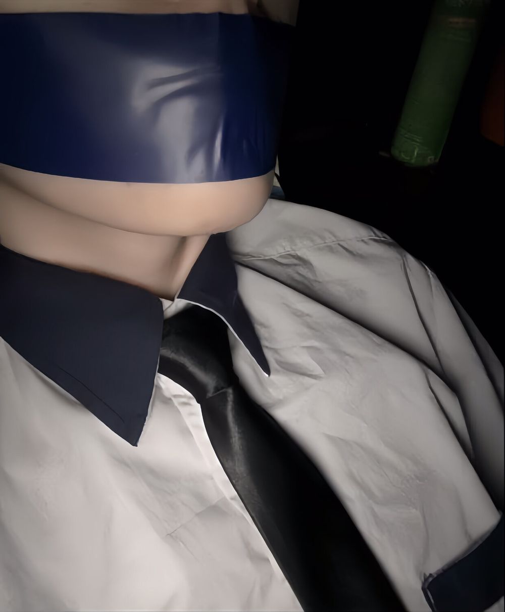 Wearing a white shirt and shiny black tie, gagged with duct  #9