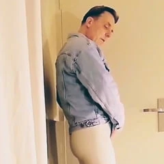 Arousal in white vinyl leggings