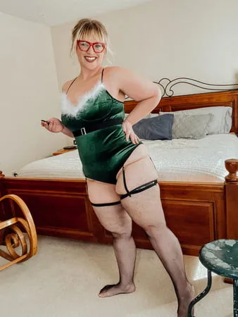 bbw christmas elf in fishnet thigh highs and heels         