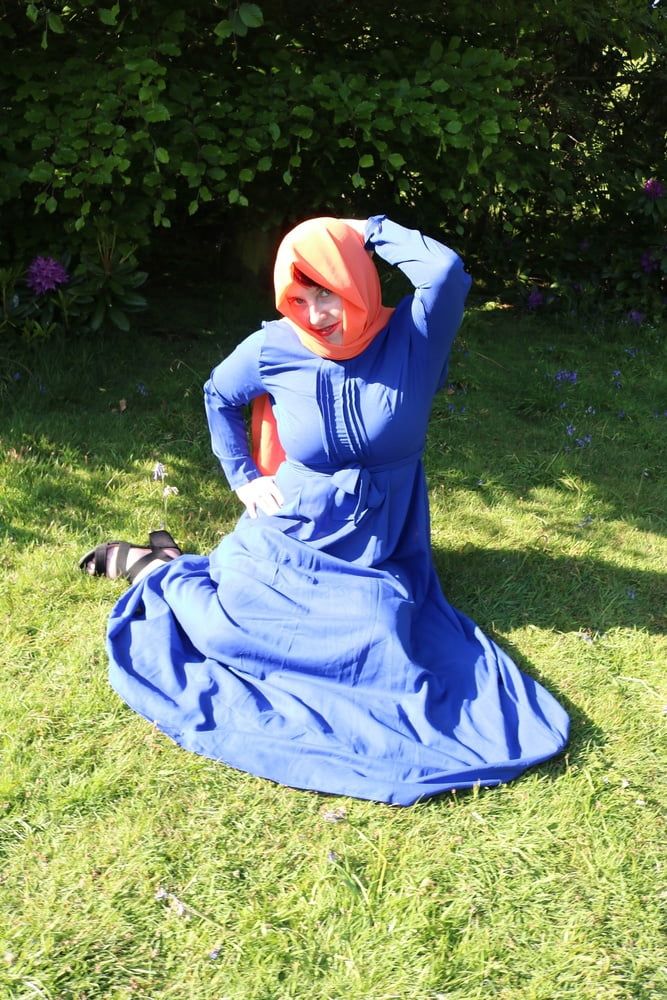 hijab and abaya flashing outdoors #10