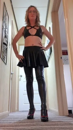 black latex bra skirt suspenders and stockings no panties         